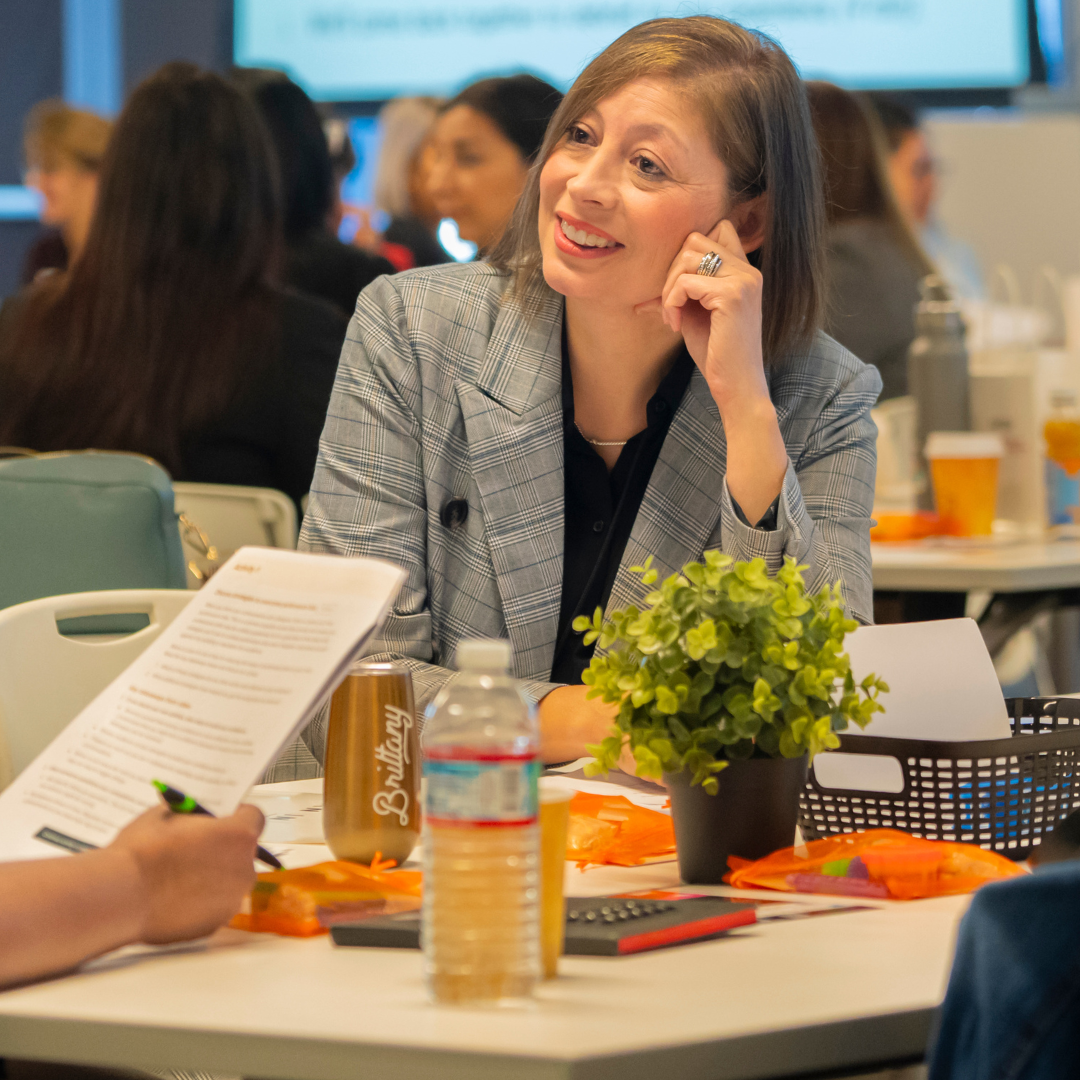 Woman reviewing resources at a Lean In Latinas event